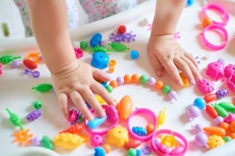 Close up of child's hands playing Stock Photos