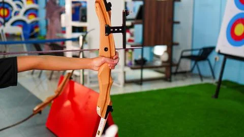 Close up of child's hands practicing archery. Practice with a bow Stock Photos