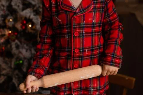 Close-up of a child's hands rolling out cookie dough for Christmas Stock Photos