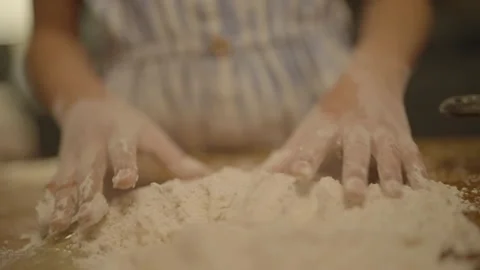 Close-up of child's hands starting to knead flour Stock Footage 336374694