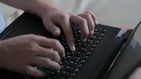 Close-up of a child's hands typing on a computer 스톡 동영상 129185048