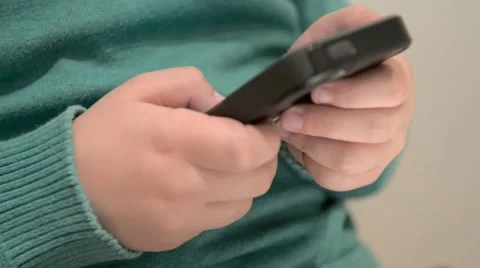 Close up of child's hands using smartphone Stock Footage 54098623