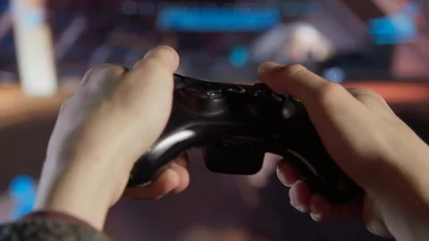 Close Up Of A Child's Hands Whilst Playing Video Games 스톡 동영상 106379029