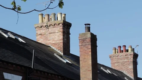 Close up of Chimneys and slate tiled roof tops of traditional Victorian houses 動画素材 73513588