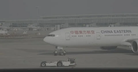 Close-up of a China Eastern Airlines airplane on runway Stock Footage 316596110
