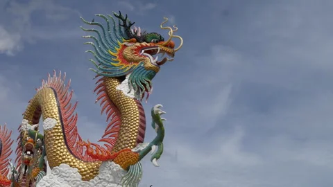 Close-Up Chinese Dragon Statue Under Blue Sky Timelapse Stock Footage 321672475