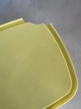 Close-up of Chipped Light Yellow Plastic Lid Stock Photos