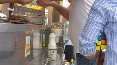 Close up of chips being seasoned Stock Footage 94590426