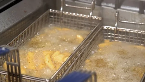 Close up of Chips in Deep Fat Fryer Stock Footage 101341553
