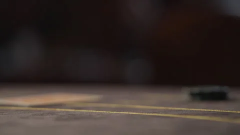 Close-up of chips falling on the gaming table. Playing poker Stock Footage 273033261