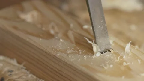 Close up of a chisel carving wood Видео 153109405