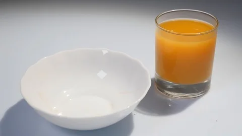 Close-up of chocolate balls are falling in a glass dish. Chocolate balls falling Stock-Footage 90177597