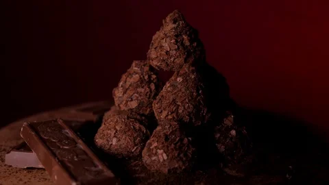 Close up chocolate bars with truffles dark food video 4K Stock Footage 129539241