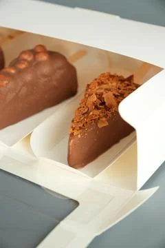 Close Up of Chocolate Cheesecake Pops Inside Packaging Box Stock Photos