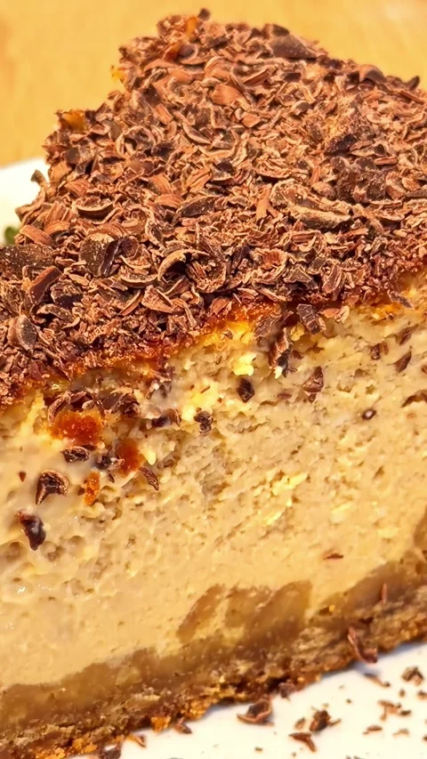 Close-Up of Chocolate-Covered Cheesecake Slice on Plate Stock Footage 336007376