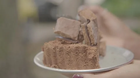 Close-Up of Chocolate Dessert Slice Held on Plate Outdoors in Sydney Cafe Stock Footage 345666558