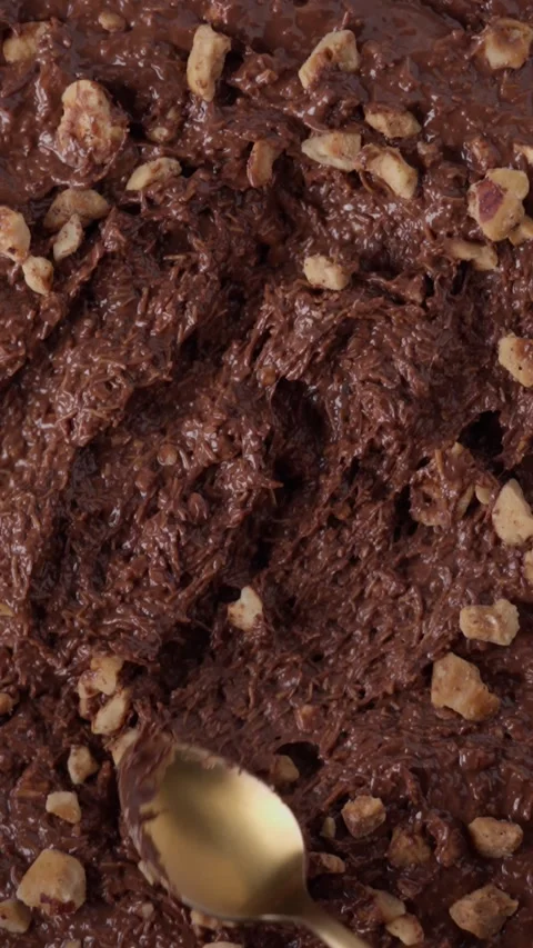 Close-up chocolate mixture with hazelnuts and kataifi Stock Footage 332084528