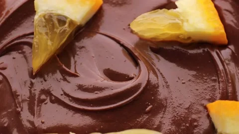 Close up of chocolate with orange, rotation in circle. Stock Footage 233901245