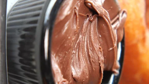 Close up chocolate paste in small black bowl for breakfast, dynamic food fo.. Stock Footage 332545680