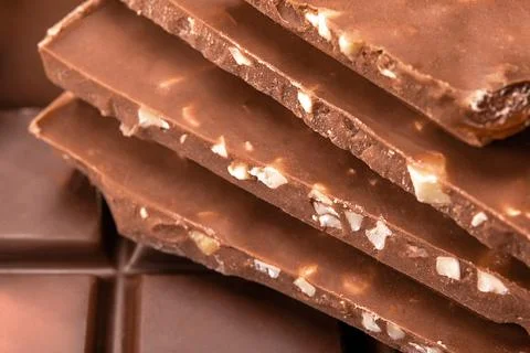 Close up of chocolate pieces stack. Stack of milk chocolate slices. Chocolate Stock Photos