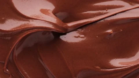 Close up of chocolate, rotation in circle. liquid chocolate Turning. Stock Footage 233288807
