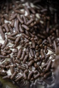 Close-up of chocolate sprinkle on a donut. Stock Photos