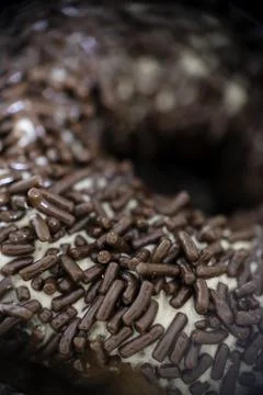Close-up of chocolate sprinkle on a donut. Stock Photos
