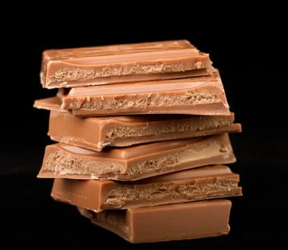 Close-up of chocolate stack with black background 스톡 사진