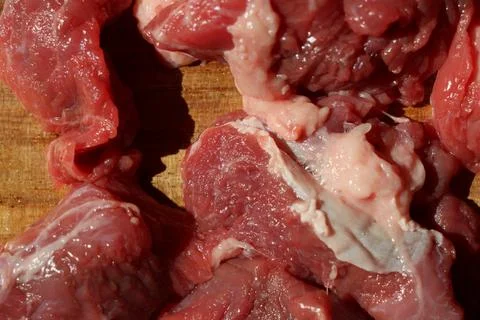 Close up of choped red beef or goulash on a wooden cutting board Stock Photos