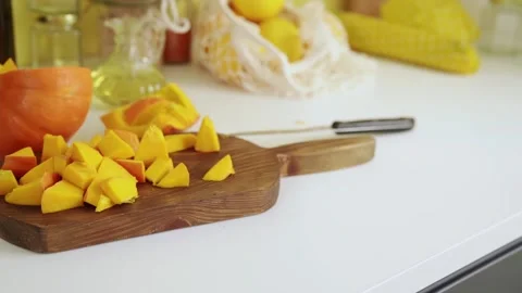 Close up of chopped pumpking on cutting board 스톡 동영상 159142070