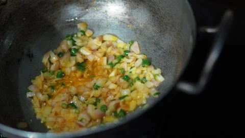 Close-up of chopped vegetables and herbs cooking in a pan, fresh ingredient.. 스톡 동영상 346597661