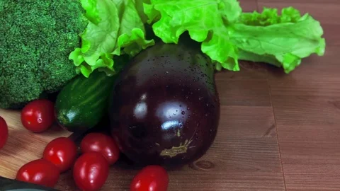 Close-up of chopping board with knife on table with vegetables.  Stock Footage 83997849
