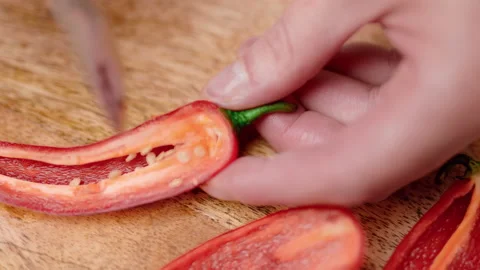 Close-up chopping Chili Pepper with a chef knife in 4K. Stock Footage 138303352