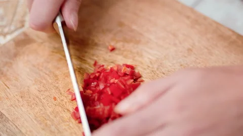 Close-up chopping Chili Pepper with a chef knife in 4K. Stock Footage 138303568