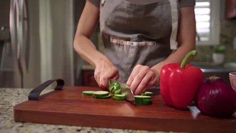 Close up chopping cucumber Stockbeeldmateriaal 336042397
