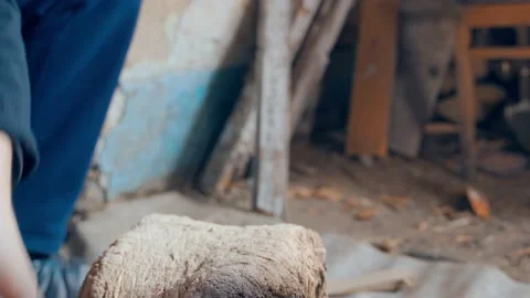 Close-up of chopping firewood into small chips on a stump Stock Footage 201611617