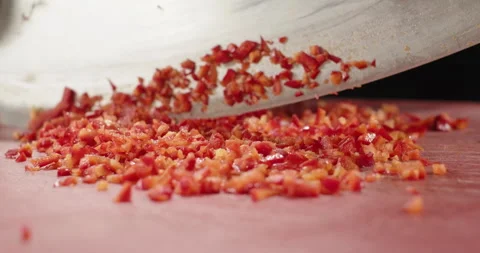 Close-up chopping fresh red bell pepper with big knife. Healthy lifestyle food Stock Footage 258557954