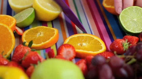 Close up Chopping fruit in colorful kitchen scene Stockbeeldmateriaal 42180856