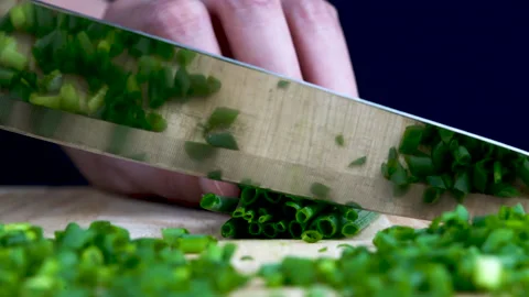 Close up chopping onion in straight view by woman Stock-Footage 136352145