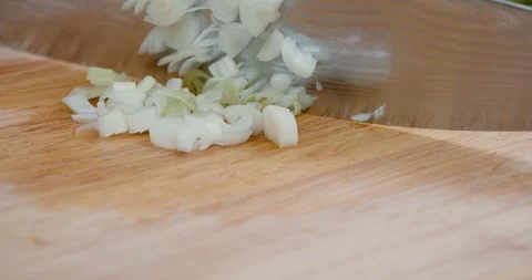 Close up of chopping spring onions Stock Footage 119845374