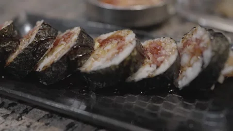 Close up chopstick grabs sushi roll Stock Footage 305791566