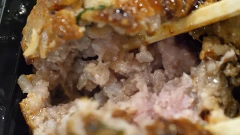 Close-up of Chopsticks Breaking Open Juicy Fried Pork Meatball 動画素材 343587336