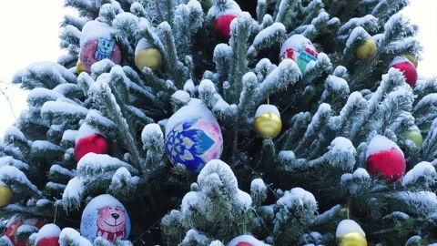 Close-up of Christmas baubles with patterns on spruce branches Video stock 327774648