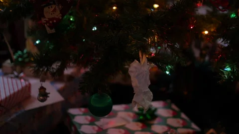 Close up Christmas decorations hanging on a tree Stock Footage 153788367