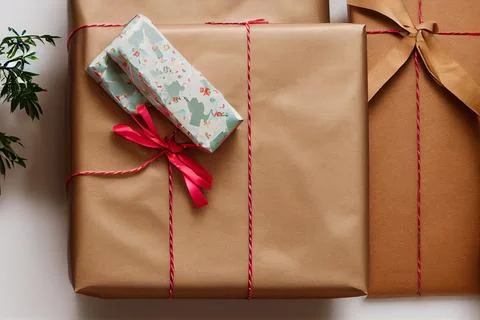 Close-Up of a Christmas gift box on white background with colored paper design. Stock Illustration