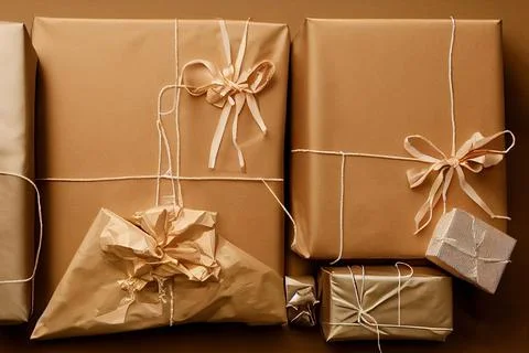 Close-Up of a Christmas gift box on white background with colored paper design. Illustrazione stock
