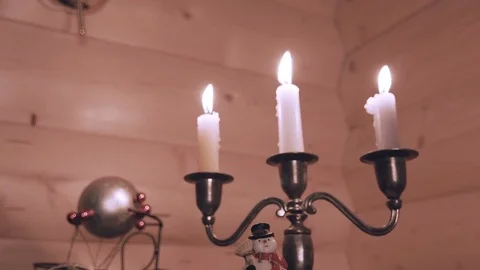 Close-up of Christmas interior decorations. Burning candles, ball of gold color. Stock Footage 81713924