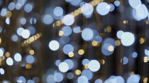 Close-up of Christmas lights that create bokeh when they are out of focus. Stock Footage 108468169