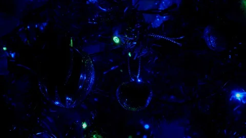 Close up christmas lights on tree flashing fast Stock Footage 99776607