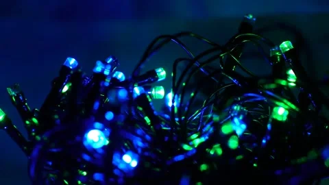 Close-up christmas lights twinkle in the dark Stock Footage 162977195